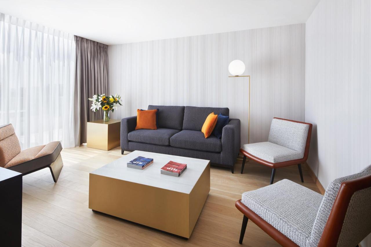 Grand Hyatt Athens Hotel Exterior photo A living room at the hotel